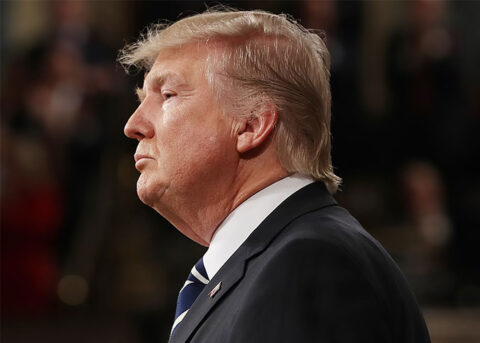 Man in suit, determined against Trump stance.