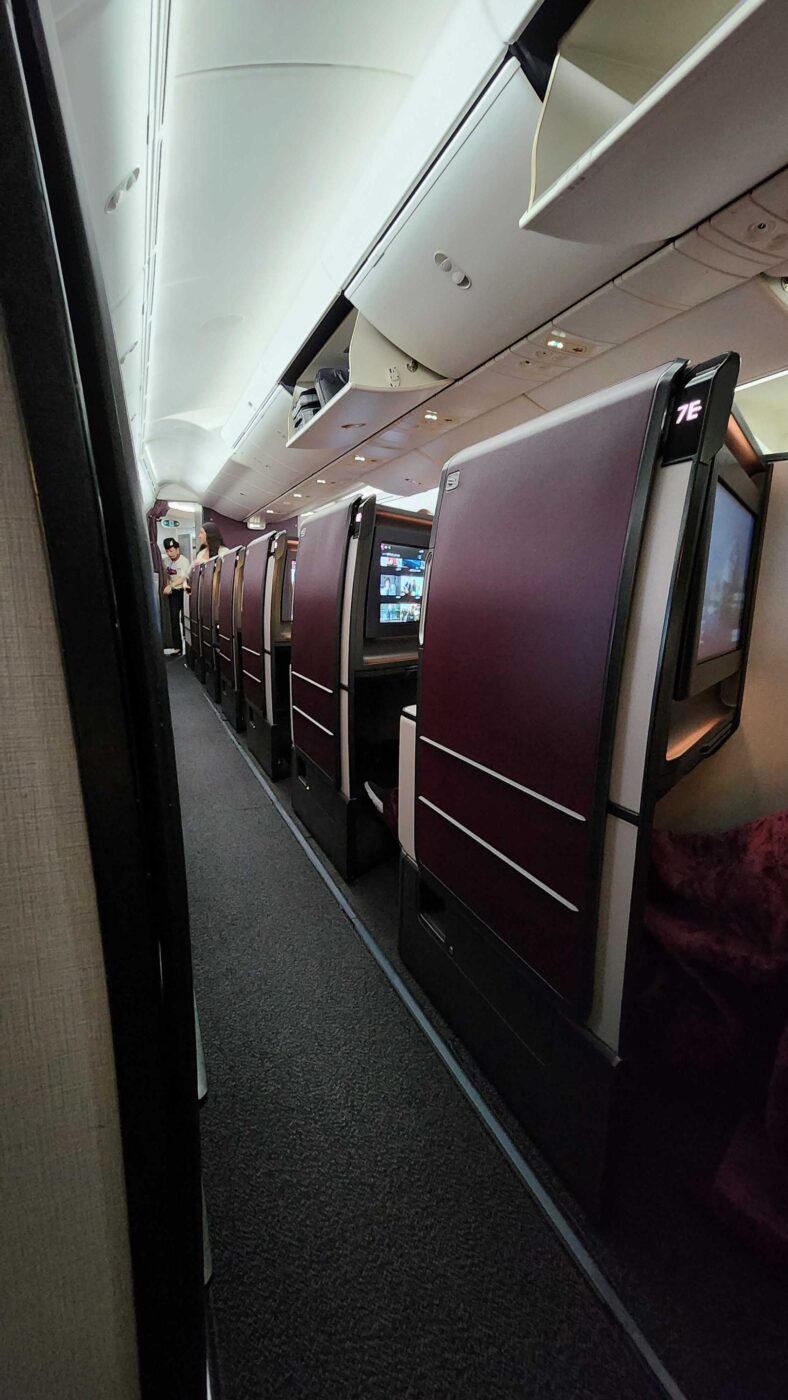 Qatar Business Class cabin with luxurious suites.