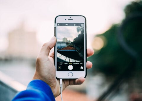 Person takes photo with Apple iPhone.