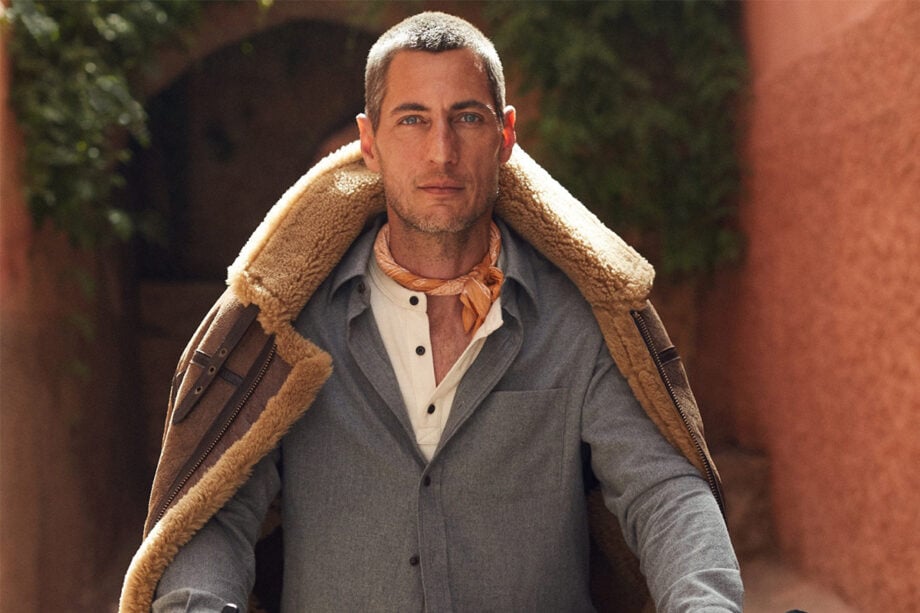 Outdoor fashion: blue shirt, brown jacket, and scarf.