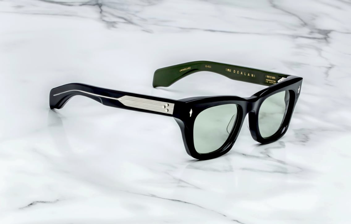Black sunglasses with green lenses, Jeff Goldblum style.