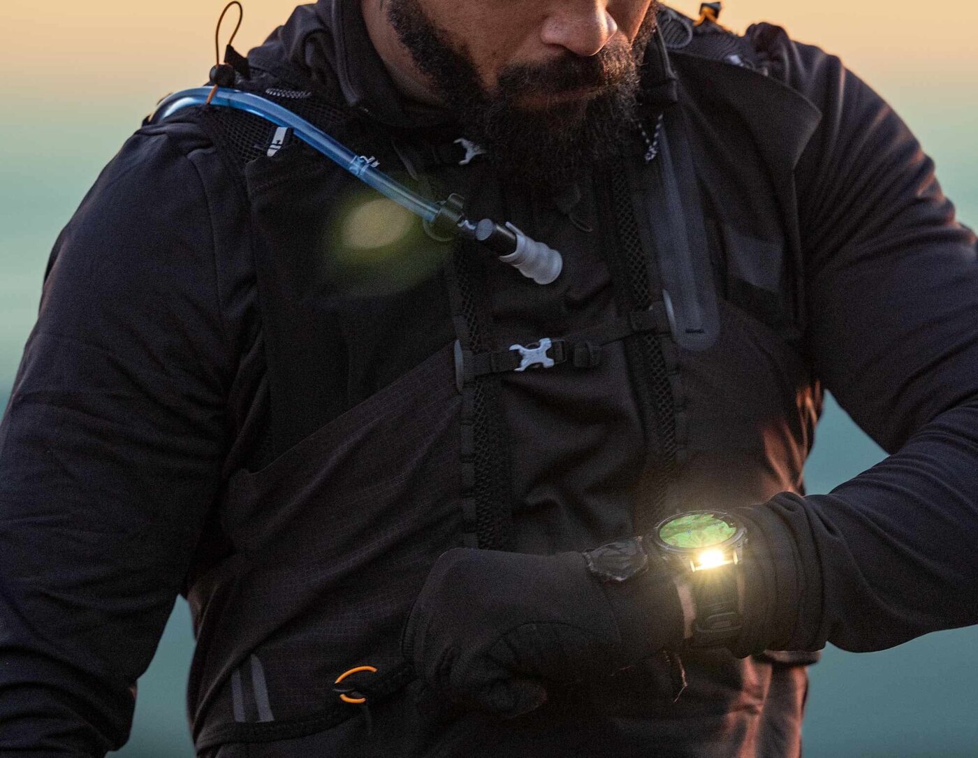 Person checks Garmin Fenix 8, ready to explore.