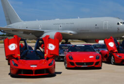 Luxury Ferraris parked by Aeronautica Militare plane.