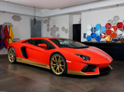 A red Aventador Miura with gold indoors.