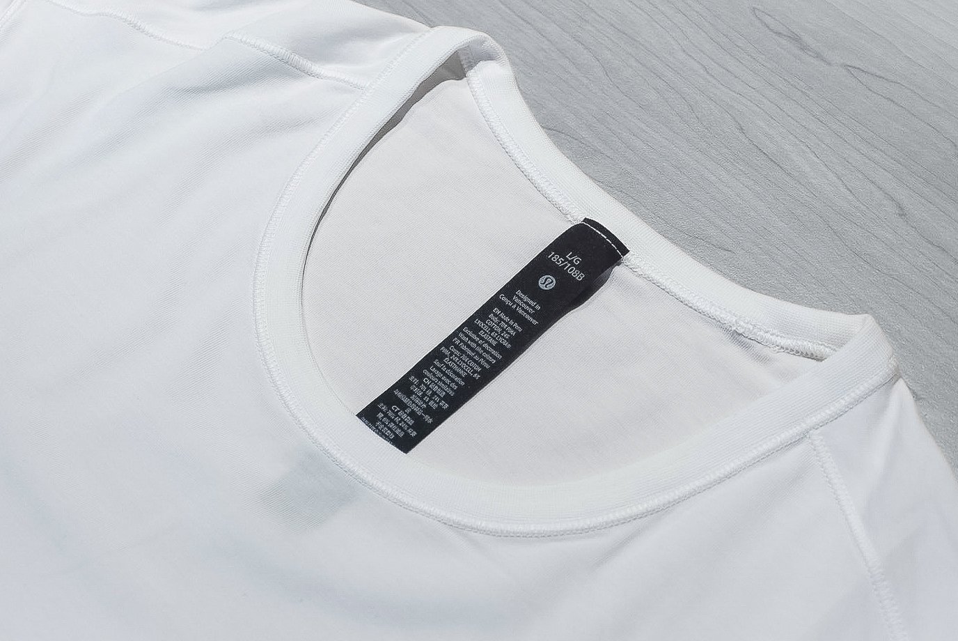 Lululemon white tee collar and label close up