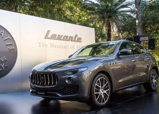 Maserati Levante SUV displayed against lush backdrop.