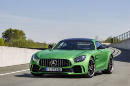 Green Mercedes AMG GT R with sleek design.