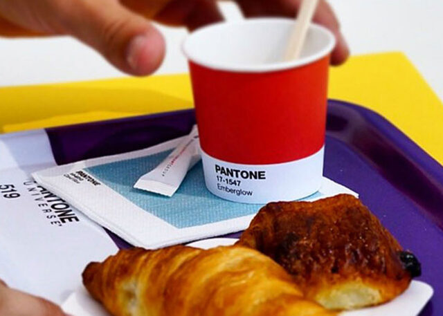 Pantone Cafe tray with Emberglow cup, pastries.