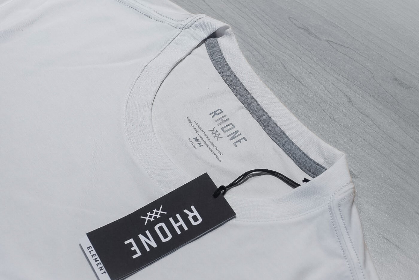 Rhone white tee collar and label close up