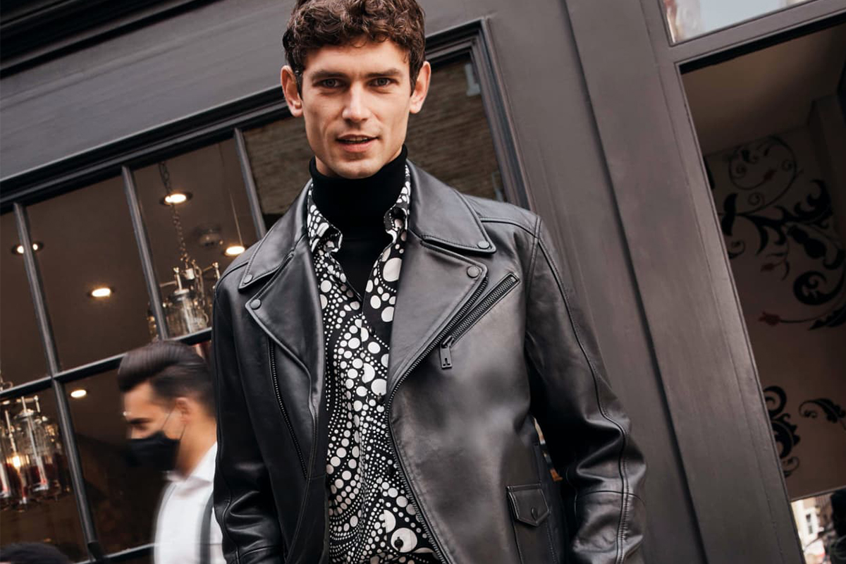 In leather jacket showcasing men's fashion trends.
