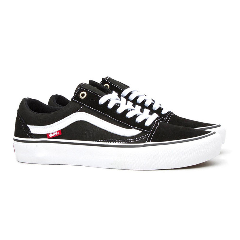 Black and white sneakers, red logo, stylish.